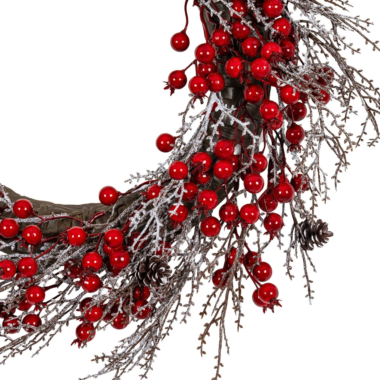 Close-up of Hill Interiors Winter Wreath with Red Berries showing glossy red berry clusters, frosted twigs and small pinecones on a white background.