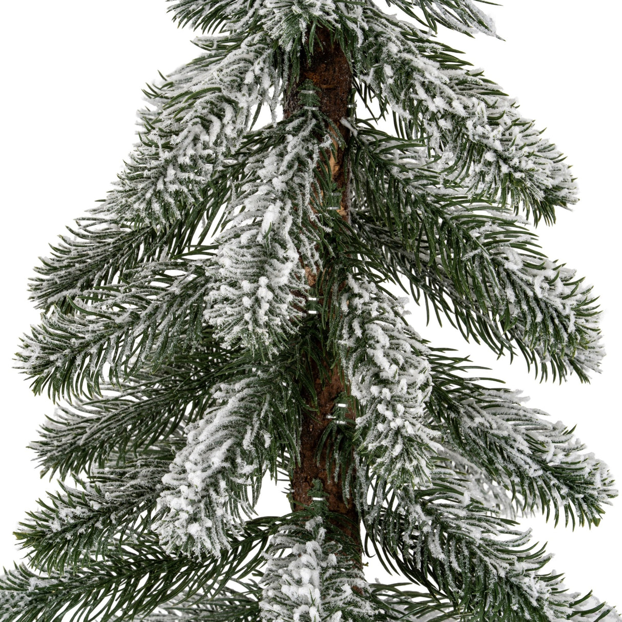 Close-up of Hill Interiors Medium Snowy Pine Tree showing green plastic needles with a light snow dusting around a natural wooden trunk.