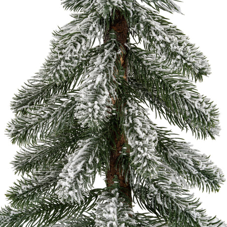 Close-up of Hill Interiors Medium Snowy Pine Tree showing green plastic needles with a light snow dusting around a natural wooden trunk.