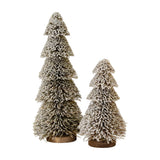 Hill Interiors Large Tiered Snowy Brush Tree in brown beside a smaller tiered brush tree, both with snow-dusted tips and wooden bases on a white background.