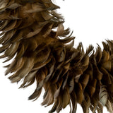 Close-up of Hill Interiors Fawn Feather Wreath in brown, showing layered faux feathers fanning outwards in caramel and deeper brown tones on a white background.
