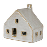 Hill Interiors ceramic cottage LED light in white glaze, with pitched roof, chimney and cut-out windows, shown against a plain white background.
