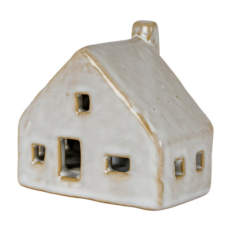 Hill Interiors ceramic cottage LED light in white glaze, with pitched roof, chimney and cut-out windows, shown against a plain white background.