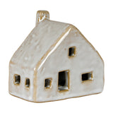 Hill Interiors ceramic cottage LED light in white glaze, with pitched roof, chimney and cut-out windows, shown on a plain white background.
