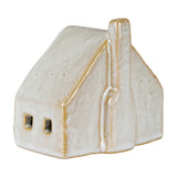 Hill Interiors ceramic cottage LED light in white glaze, with pitched roof, tall chimney and two small square windows, shown on a plain background.