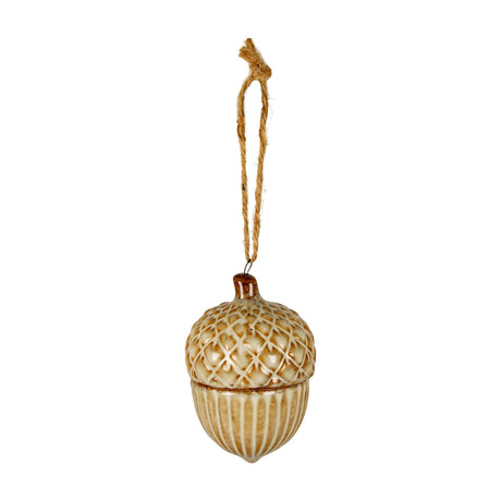 Hill Interiors ceramic acorn ornament with textured cap and ridged base in warm cream and brown glaze, hung from jute string against a white background.