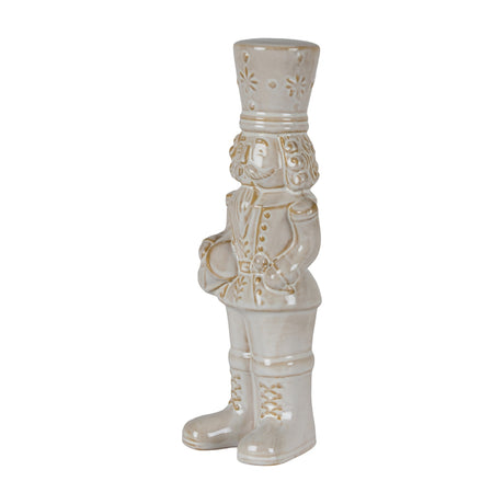 Hill Interiors Ceramic Nutcracker with Drum in white glaze, shown from the side with tall hat, moustache and lace-up boots against a plain background.