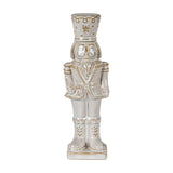 Hill Interiors Ceramic Nutcracker with Candy Cane in white with soft gold detailing, shown against a plain white background.
