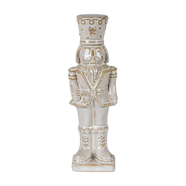 Hill Interiors Ceramic Nutcracker with Candy Cane in white with soft gold detailing, shown against a plain white background.