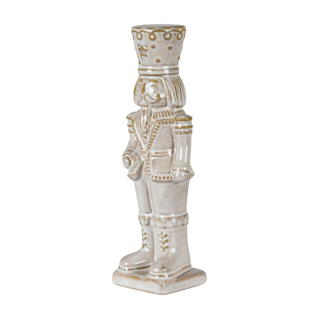 Hill Interiors ceramic nutcracker figure in white with gold-toned detailing on the crown, uniform and boots, shown against a plain white background.