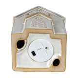 Underside of the Hill Interiors ceramic townhouse showing the white LED battery compartment with on/off switch set into the glazed base.