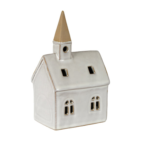 Hill Interiors ceramic church LED light in white with peaked roof, arched windows and slender tower with tan spire, shown on a plain background.