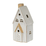 Hill Interiors ceramic medium townhouse LED light in white glaze, with pitched roof, chimney, arched door and cut-out windows, on a plain background.