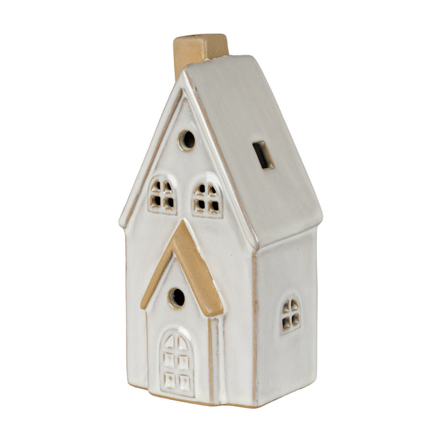 Hill Interiors ceramic medium townhouse LED light in white glaze, with pitched roof, chimney, arched door and cut-out windows, on a plain background.
