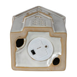 Underside of the Hill Interiors ceramic medium townhouse showing the white LED battery compartment with on/off switch against a plain white background.