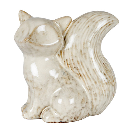 Hill Interiors ceramic fox ornament in a white glaze with subtle speckling, head turned left with a bushy curved tail, shown on a plain background.