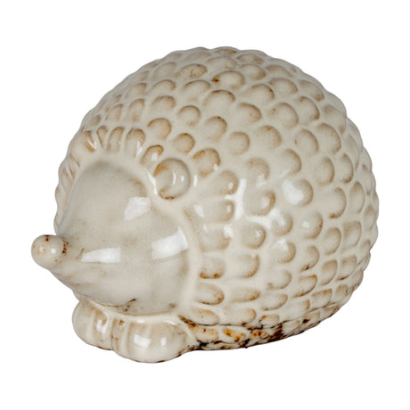 Hill Interiors ceramic hedgehog ornament in white glaze with textured spines, shown in profile against a plain white background.