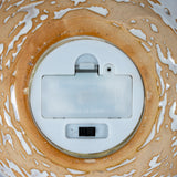 Underside of Hill Interiors ceramic snowman showing white battery compartment with on/off switch, set within the tan and white drip-glazed base.