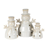Hill Interiors ceramic snowman LED lights in white glaze with top hats, scarves and star cut-outs, shown in three sizes on a plain white background.