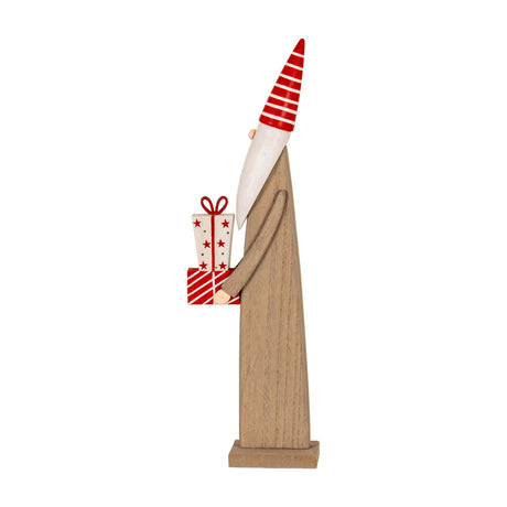 Hill Interiors Wooden Festive Elf side view, brown wood figure with red striped hat holding wrapped presents, on a plain white background.