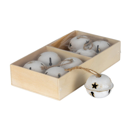 Hill Interiors set of eight large white metal jingle bells with star cut-outs and jute loops, presented in a wooden box on a plain background.