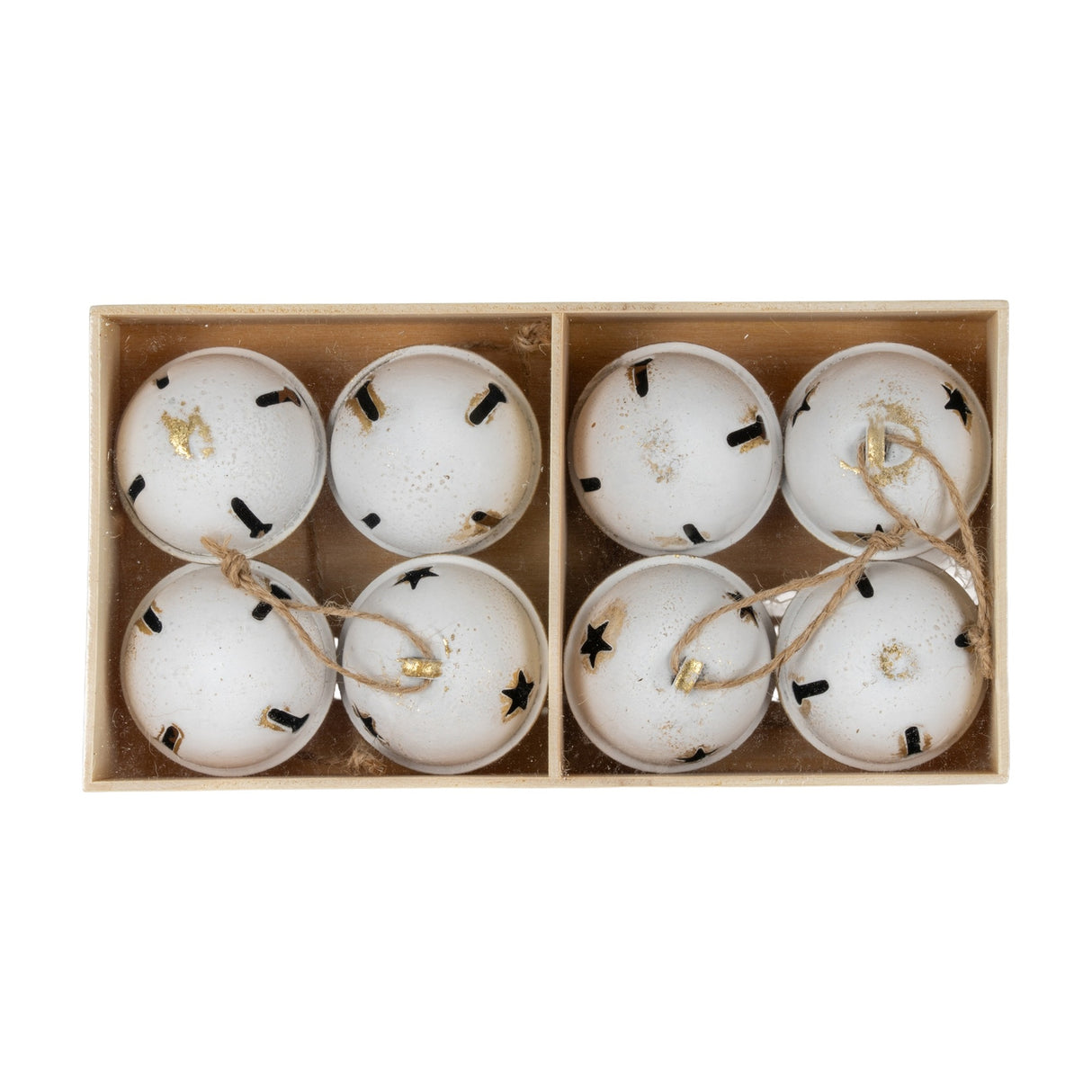 Hill Interiors set of eight large white metal Christmas bells with black star cut-outs and jute loops, arranged in a divided wooden box.