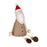 Hill Interiors Wooden Sitting Santa Decoration in brown with red hat, white beard, and dangling rope legs with wooden feet, on a plain white background.