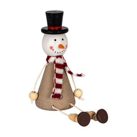 Hill Interiors Wooden Sitting Snowman Decoration in brown with black top hat, red and white striped scarf, carrot nose, and dangling bead legs.