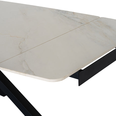 Close-up of the Hill Interiors Stanwyke extending dining table showing the beige stone-look top with soft veining and black metal frame.