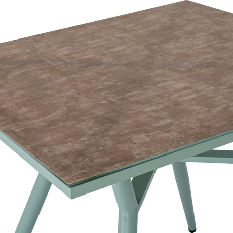 Hill Interiors French Grey Glass Table with tempered glass top in a warm brown tone, set on a soft grey frame with tapered legs.
