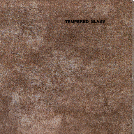 Close-up of the Hill Interiors Round Glass Side Table in beige, showing the mottled putty-toned tempered glass surface with a small printed label.