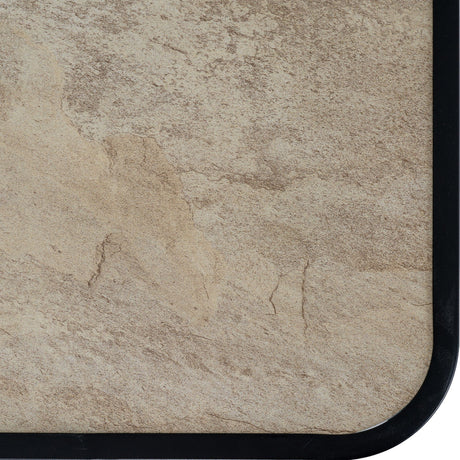 Close-up of the Hill Interiors Outdoor Metal Bistro Set table top showing a mottled beige stone-effect surface framed by a black metal edge.
