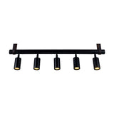 Holmes Brass 5 Light Spotlight Bar featuring a matt black horizontal bar with five cylindrical spot heads, suspended by brass-toned leather straps against a plain white background.