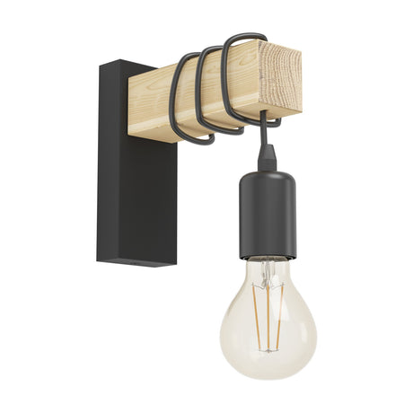 Hosmane Wall Light with slim black steel backplate and pale wood beam, black cord looped along the wood before dropping to a bare E27 lampholder with exposed bulb, shown on a plain white background.