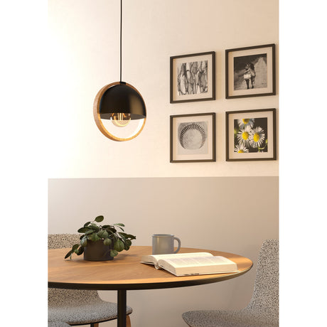 Hosorne Pendant Light in black and brown, a round steel dome within a wooden ring on a black cord, shown above a dining table with an exposed E27 bulb.
