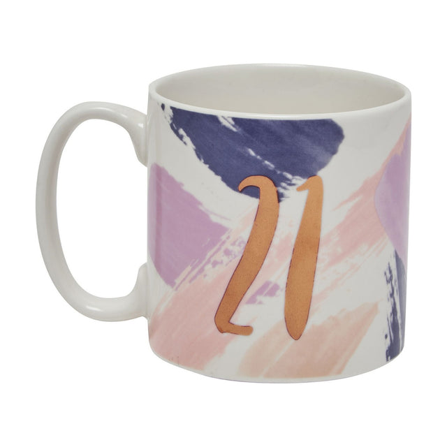 Porcelain "21" Birthday Babe mug with copper script lettering over lilac and blush brushstroke design, straight sides and loop handle, on a white background.