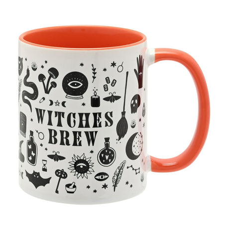 White stoneware mug with orange interior and handle, printed with "Witches Brew" and black Halloween motifs including a crystal ball, broomstick, skull, bat and moon, on a plain white background.