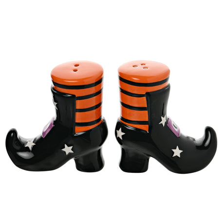 Ceramic salt and pepper set shaped as black witch's boots with curled toes, orange-and-black striped tops, purple buckles and white stars, shown on a plain white background.