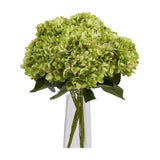 Hill Interiors Green Hydrangea Bunch, a faux arrangement with domed green floret heads and leafy stems displayed in a clear tapered glass vase.
