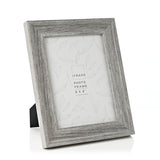 Grey embossed wood-effect photo frame with wide stepped rectangular moulding and rear easel stand, shown at an angle on a plain white background.
