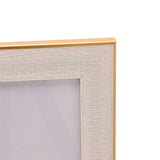 Close-up of the Thin Edged Textured Plastic Photo Frame corner in White & Gold, showing the woven-textured white border and slim gold edge against a plain background.