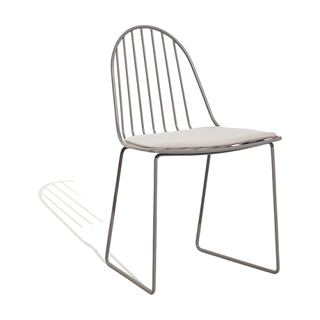 Illa steel stacking garden dining chair with curved vertical rod back, sled base in grey finish, and removable beige seat pad, shown on a plain white background.