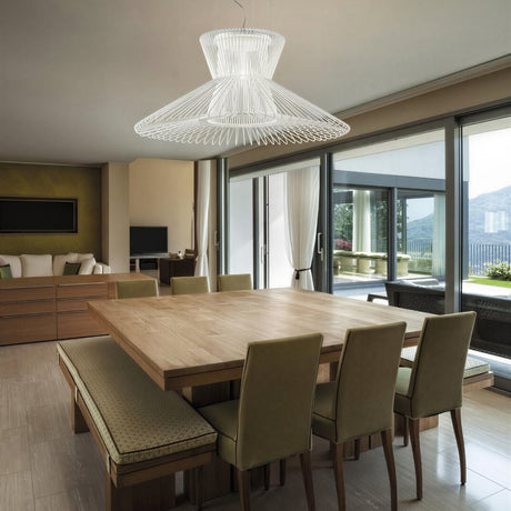 Impossible 105cm Flared Pendant Light in white woven metal mesh with flared, hat-like shape, shown suspended above a dining table in a modern living space.