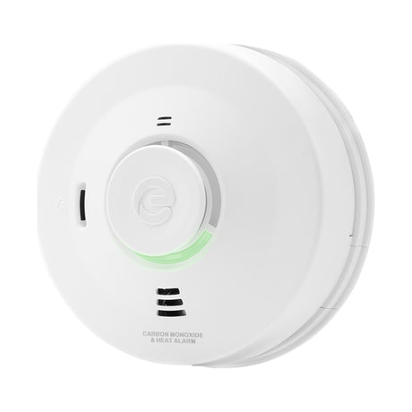 Espire mains-powered carbon monoxide and heat alarm in round white casing with central test button and green status light, on a plain background.