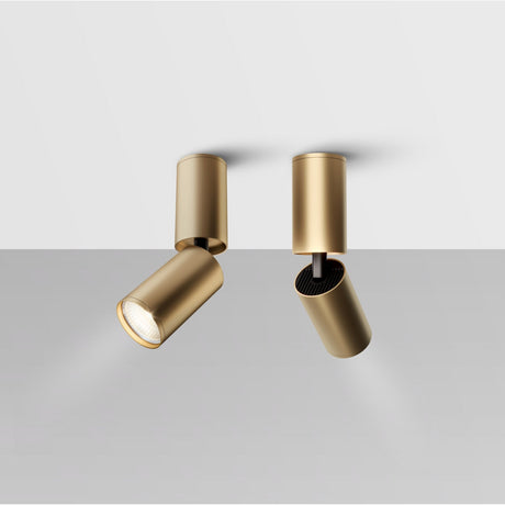 Interior view of Focus S Long Single Surface-Mounted Spotlight in gold, enhancing a modern space with warm lighting