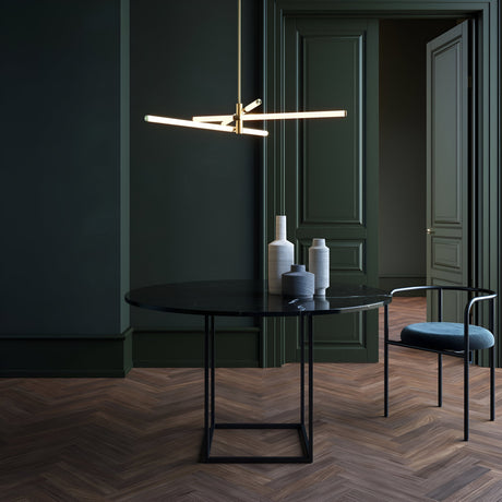 Axis chandelier in gold and white, designed to bring a touch of elegance to luxurious interiors.