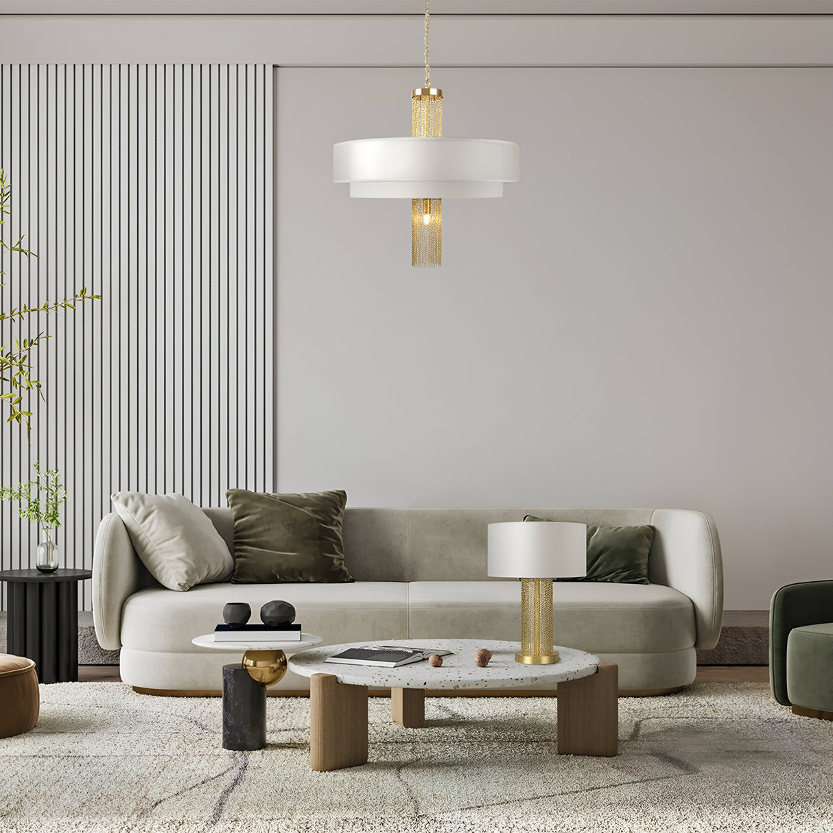 A modern living room exuding elegance with a green velvet sofa, round coffee table, and gold accents. The focal point is the Impressive 5 Light Chandelier - Gold adorned with gold-tone chains. Other features include a striped white wall panel, green plant, decorative objects, and a plush beige rug.