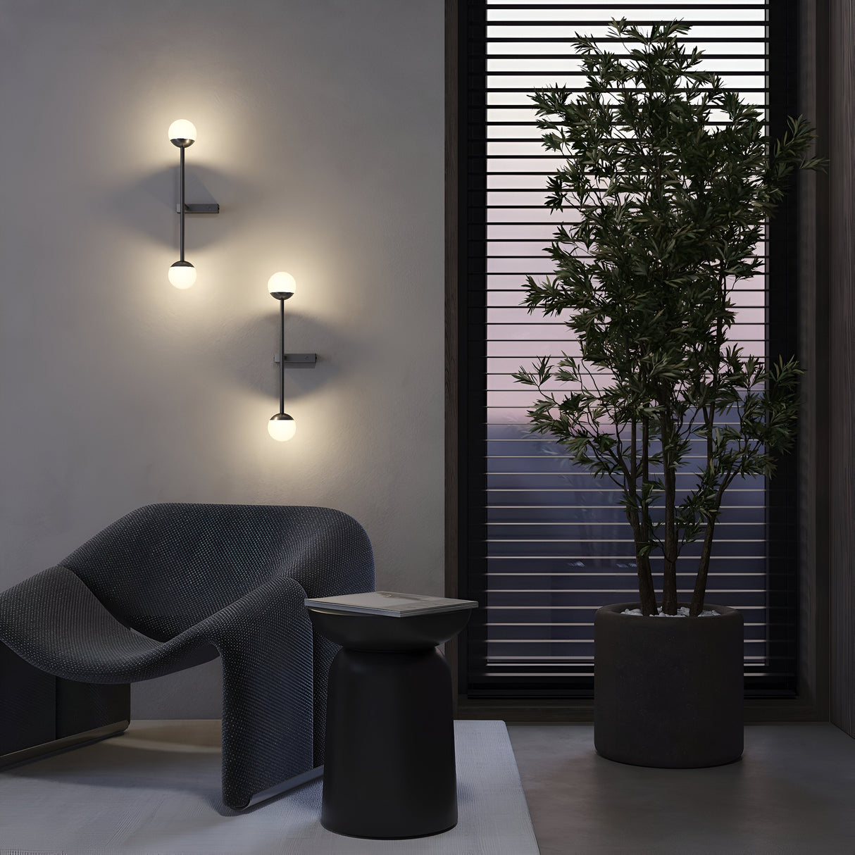 A modern living room features a stylish dark grey armchair, a small round side table, and a tall potted plant by a window with venetian blinds. The space is illuminated by two Touch LED 4-Step Touch Dimmable Wall Lights (3000K 10W - Black), creating a cozy and minimalist ambiance.