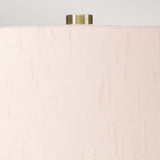 Close-up of the upper section of a cylindrical beige lampshade with a smooth texture. A small, metallic, cylindrical finial is prominently visible at the top against a light gray background, seamlessly enhancing the elegance of the Isla 1 Light Table Light - White/Light Pink ceramic base lamp.