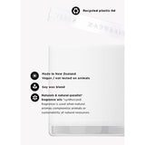 White round scented candle vessel with recycled plastic lid, Neroli & Amber Wood 400g, showing feature icons for vegan soy wax blend made in New Zealand.